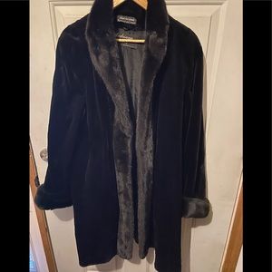 Adriana Furs- Black sheared knee-length mink.